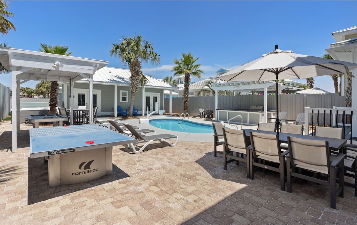 Luxury home exterior with private pool and entertainment area